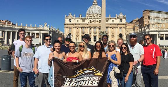 Perugia students holding a Bonnies banner outside the Vatican in Rome