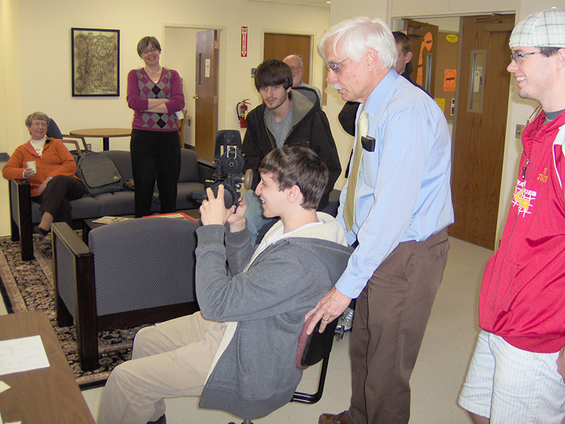 A student uses a bubble sextant as Phil Winger jostles his chair to create "turbulence."