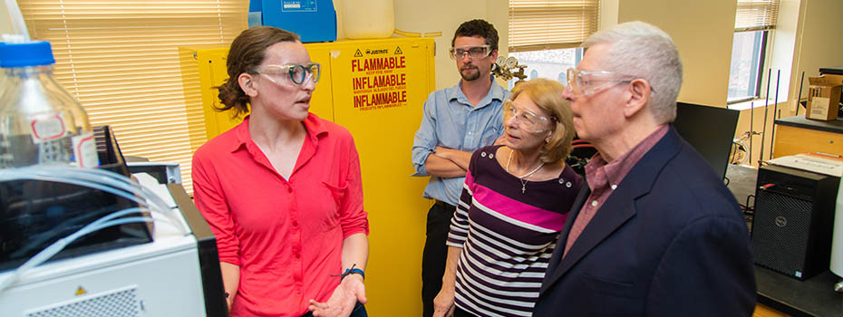 Corinne and Daniel Maydonovitch in chemistry research lab with Katie Heitzman and Dr Scott Simpson