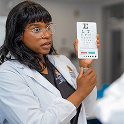Female nursing student Female nursing student with eye chart
